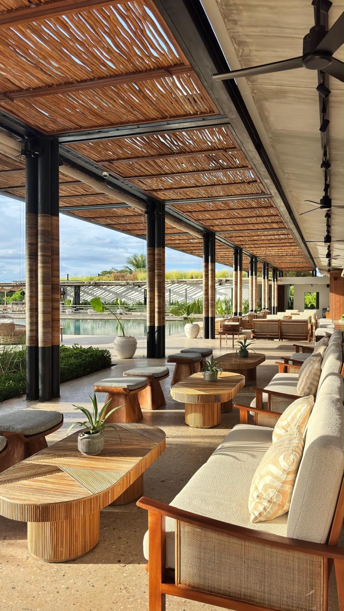 Open lounge with natural materials and daylight.